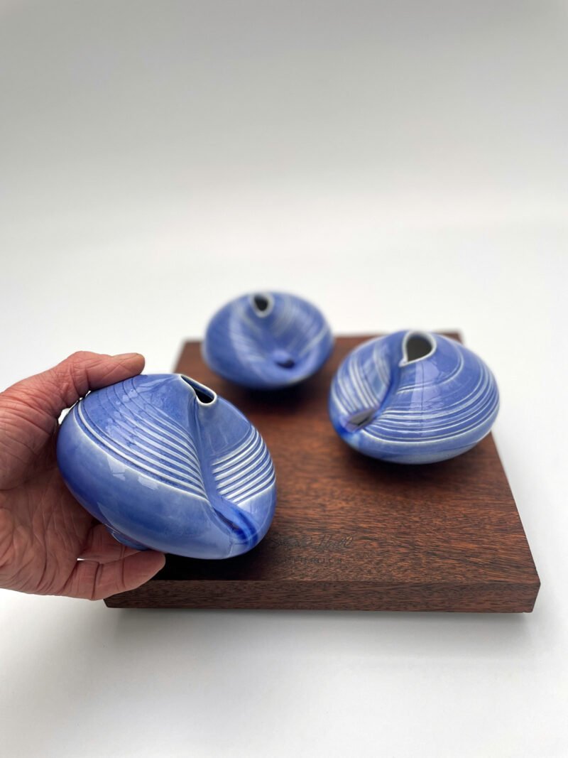 A trio of blue neckline dimple pots